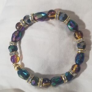 NWT Handcrafted Iridescent and Gold Beaded Bracelet and Earrings Set.
